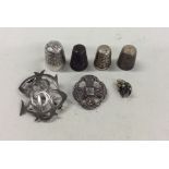 A quantity of silver mounted thimbles, brooches et