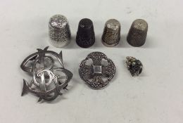 A quantity of silver mounted thimbles, brooches et