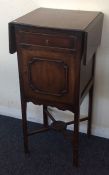 A Georgian style mahogany pot cupboard with flap t