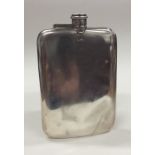 A massive silver hip flask with hinged top. Sheffi