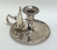 A good Georgian silver chamber stick with crested