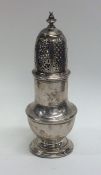 A heavy Georgian silver baluster shaped caster wit