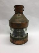 A large copper mounted Masthead ships lamp. Est. £