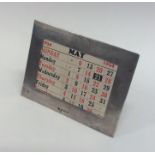 A novelty silver mounted rectangular desk calendar