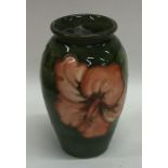 A baluster shaped Moorcroft vase decorated with fl