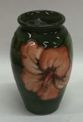 A baluster shaped Moorcroft vase decorated with fl
