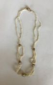 An attractive 15 carat gold seed pearl necklet. Ap