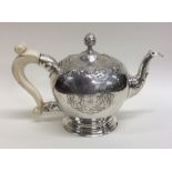 A rare George II silver bullet shaped teapot, the