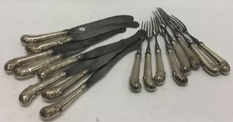 A set of eight (plus eight) Antique silver pistol