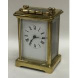 A small brass mounted carriage clock. Est. £25 - £