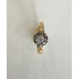 A diamond single stone ring in 18 carat gold. Appr