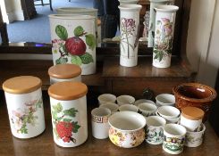 A collection of Portmeirion storage jars, vases an