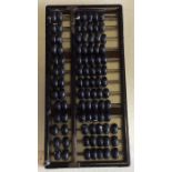 An old wooden abacus. Est. £20 - £30.