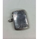 An Edwardian silver hinged top vesta case decorate