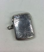 An Edwardian silver hinged top vesta case decorate