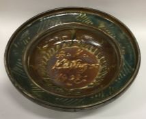 A stylish studio pottery slipware bowl in green an