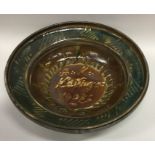 A stylish studio pottery slipware bowl in green an