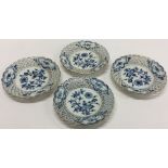 A set of four Meissen blue and white plates decora