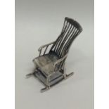 A novelty silver model of a rocking chair. Approx.