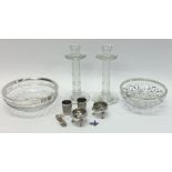 A pair of tapering glass candlesticks together wit