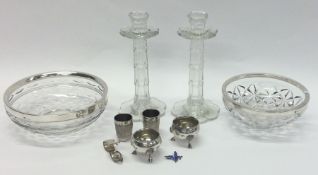 A pair of tapering glass candlesticks together wit