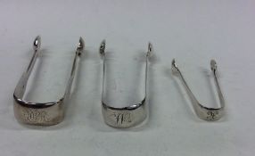 Two pairs of fiddle pattern silver sugar tongs tog