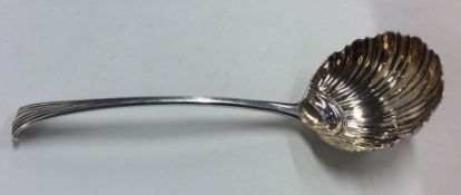 A Georgian aesthetic silver sauce ladle with flute