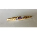 A 9 carat amethyst two colour gold brooch. Approx.