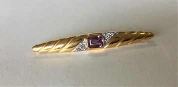 A 9 carat amethyst two colour gold brooch. Approx.