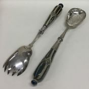A pair of Doulton Lambeth salad servers with plate