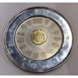 A large silver commemorative charger with gilt cen