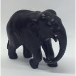 A hardwood model of an elephant with textured body