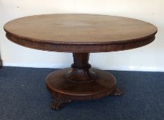 A large mahogany circular tilt-top Loo table on ta