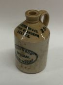 A stoneware bottle entitled, "R Southwood and Co.