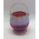 A cranberry glass opaque basket. Approx. 18 cms hi