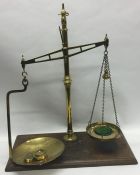 A pair of large heavy brass mounted kitchen scales