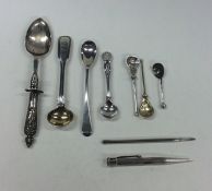 A bag containing silver mounted cruet spoons, exte