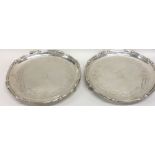 A rare pair of George II silver waiters attractive