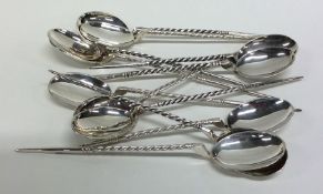 A rare set of twelve silver ice cream spoons with