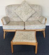 ERCOL: A two seater settee together with matching