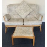 ERCOL: A two seater settee together with matching