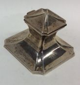 A small stylish silver capstan shaped inkwell. Bir