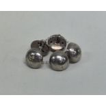 An unusual set of Georgian silver dome top buttons