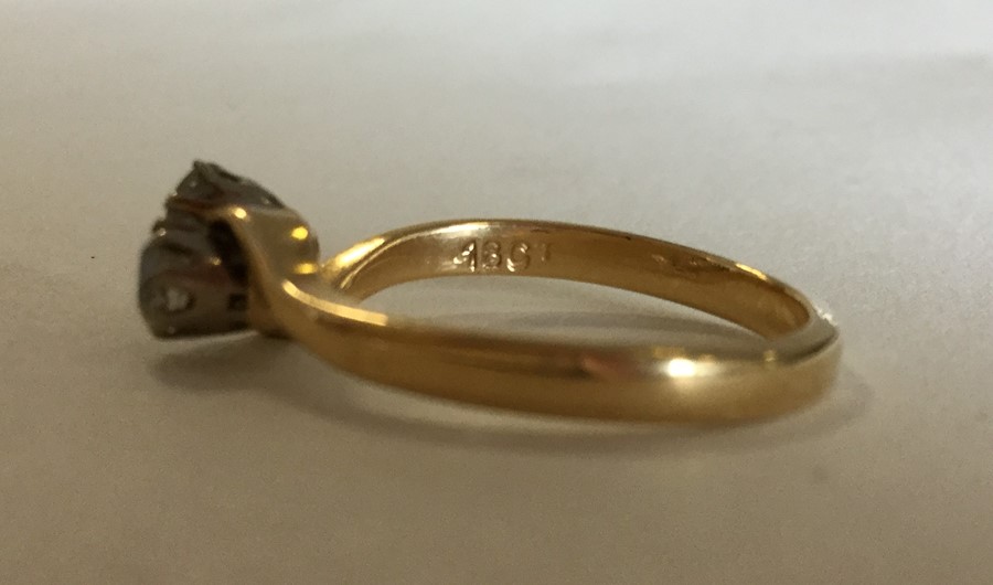 An 18 carat gold diamond two stone crossover ring. - Image 2 of 2