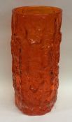 A tall Whitefriars orange glass vase. Approx. 23 cm