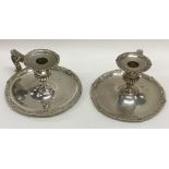 A rare pair of William IV silver chamber sticks wi