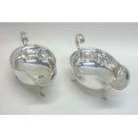 A good pair of Edwardian silver sauce boats with b