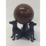 A novelty cast model of three dogs in seated posit