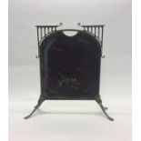 A brass and plate glass fire screen on splayed sup