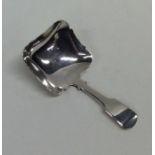 A good Georgian silver fiddle pattern caddy spoon